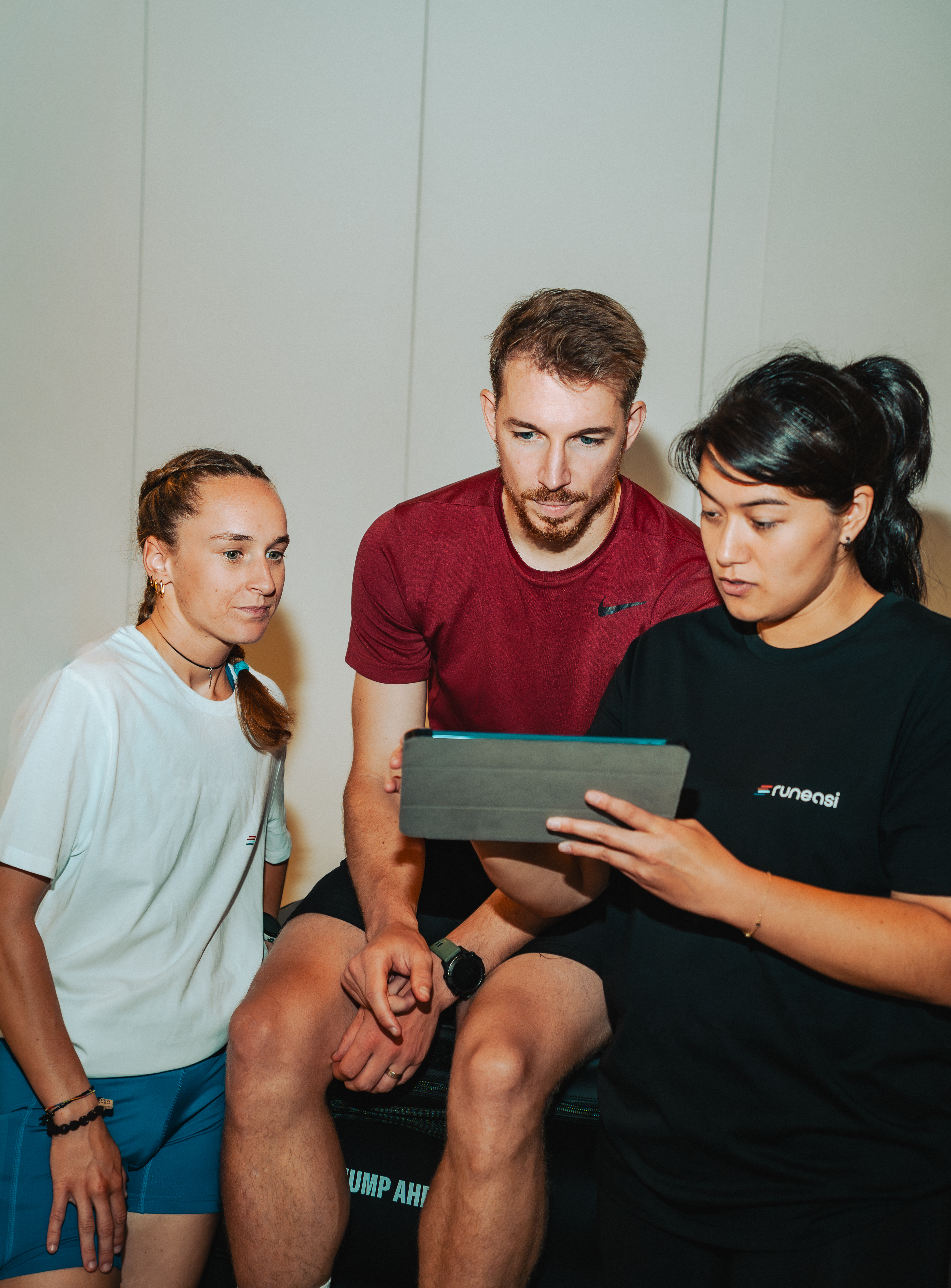 RunEasi team reviewing a biomechanics assessment on a tablet